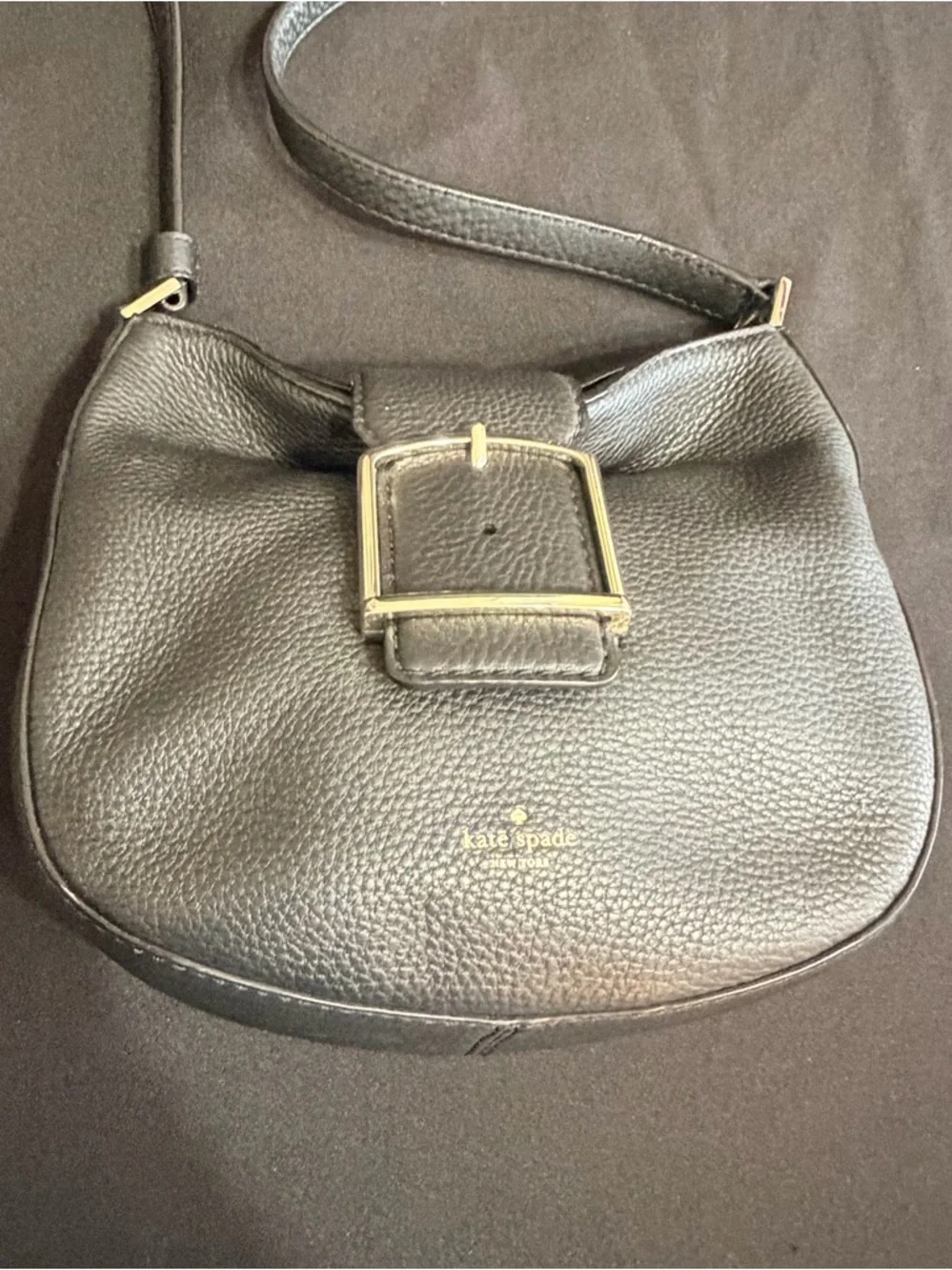 Kate Spade Black Saddle Bag Like New Condition. Very stylish and comfortable.
